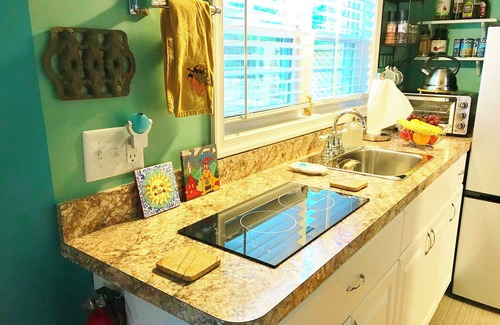Winchester House | Peaceful Secret Gardens Tiny Home - loft & stairs lead to a Queen Size Bed