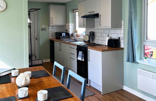 Liskeard House | Peaceful, streamside, detached bungalow - close attractions, walks & beaches