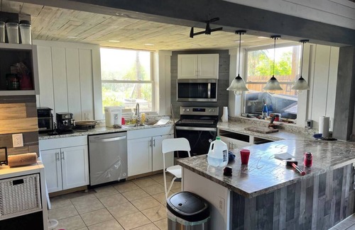 Laurel House | Peachland getaway with pool and tiki bar.