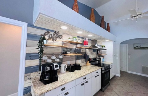 Laurel House | Peachland getaway with pool and tiki bar.