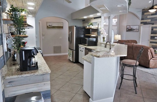 Laurel House | Peachland getaway with pool and tiki bar.