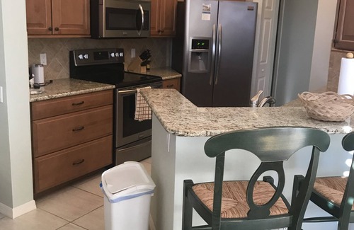 Pelican Bay Condo | Pelican Bay, Lambiance Garden Condo, second floor with full lake western view.