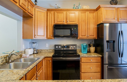 Sunset Pass Condo | Perfectly Positioned: Banana Bay Resort's Home Close to Everything You Need!