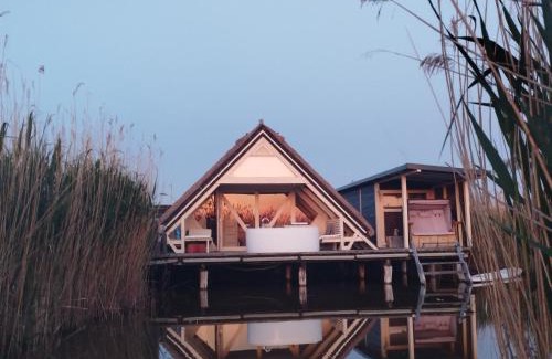 Rust House | Pfahlbau Sunset II Toplage inklusive Elektroboot