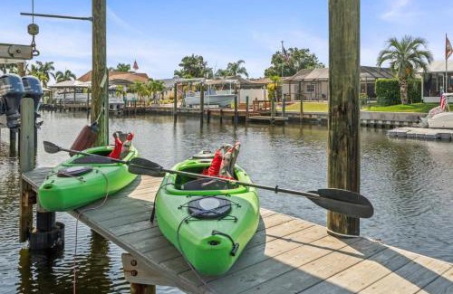 Bal Harbour House | Pirates Den a 4BR Pet-Friendly Waterfront Oasis with Pool, Dock, Personal Water Boats, Fire Pit, Game Room and Bar