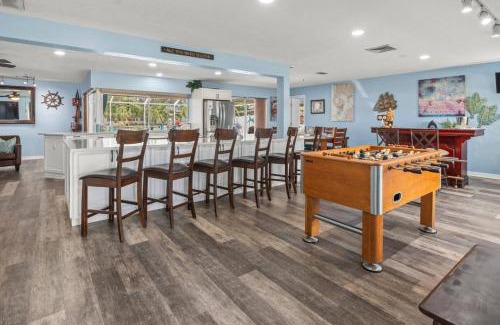 Bal Harbour House | Pirates Den a 4BR Pet-Friendly Waterfront Oasis with Pool, Dock, Personal Water Boats, Fire Pit, Game Room and Bar