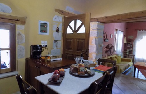 Plaka Cottage | Plakoura, a quiet cottage in village square of Plaka with a view to the sea.