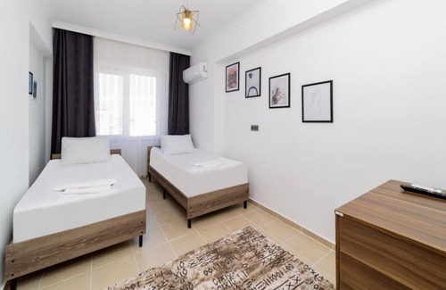 Lara Apartment | Pleasant Apartment with Balcony in Aksu