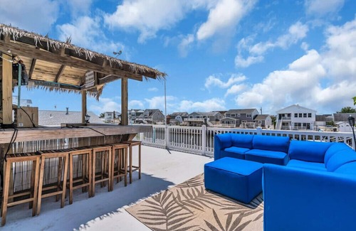 Osborn Island House | POOL, TIKI BAR, WATERFRONT home, 8 LBI Beach passes in Mystic Island NJ