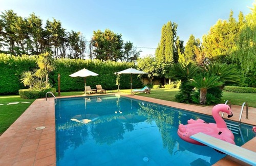 Skala Oropou Villa | Pool Villa DesmiranDive in the pleasure and relax by the pool, close to the sea.