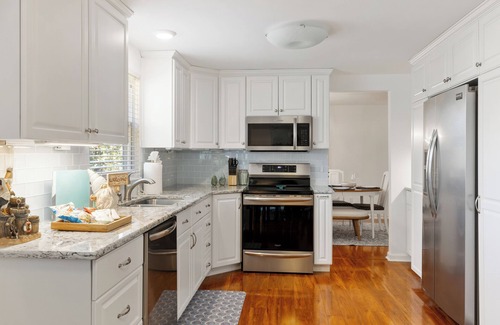 McAlpine House | Poolside Retreat - spacious 4-bedroom retreat with pool, hot tub, gym and more