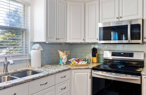 McAlpine House | Poolside Retreat - spacious 4-bedroom retreat with pool, hot tub, gym and more