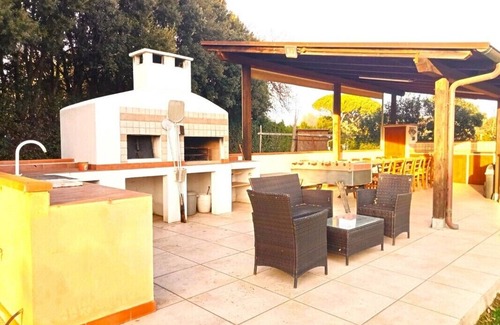 Castiglione della Pescaia Villa | Portion of villa with large garden and beautiful barbecue area 5 minutes from the sea