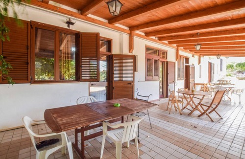 Praia a Mare Apartment | Practical apartment with open terrace and communal pool.