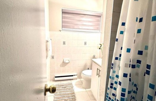 Mississauga Valleys House | Private home with large bedroom and spacious common areas with patio.