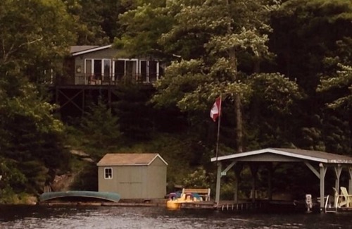 Tudor and Cashel Cabin | Private Lakefront 3 Bedroom Cabin with Private Dock and Boat Port. Boat Access