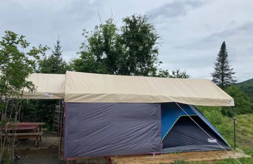 Concord RV Rental | Private Lakeside Camping with Included Tent, Air Mattresses, Kayaks, Fire Wood