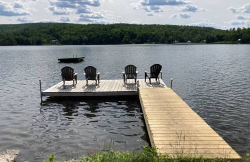 Concord RV Rental | Private Lakeside Camping with Included Tent, Air Mattresses, Kayaks, Fire Wood