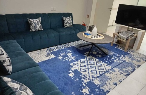 Buraydah Cabin | Private room 8m for men. Bed, AC, side table, Wi-Fi. Shared baths, lounges.