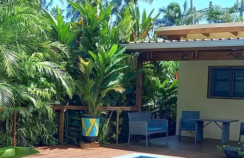 Arorangi Villa | Private, secured villa with pool surrounded by tropical lush garden