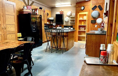 Tahlequah Cabin | Private setting in town with large yard and fire pit! Unique, vintage decor!