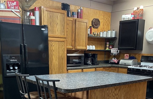 Tahlequah Cabin | Private setting in town with large yard and fire pit! Unique, vintage decor!