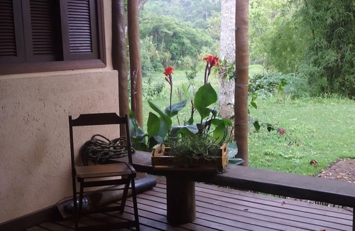 Paraty Apartment | Property with a small boat pier that makes island tours.