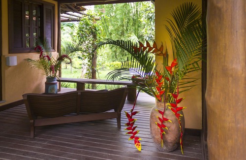 Paraty Apartment | Property with a small boat pier that makes island tours.