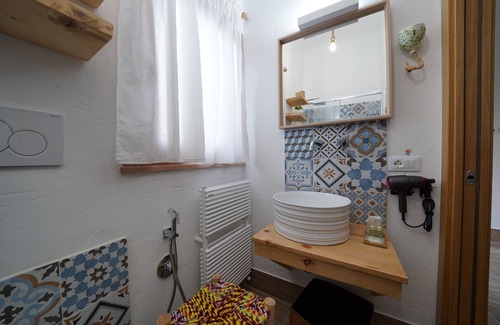 Pulsano Bed & Breakfast | Pumo room symbolizing fertility, abundance and prosperity