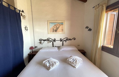 Capo Coda Cavallo Apartment | Punta Est Trilocale Soppalco con Terrazza Vista Mare