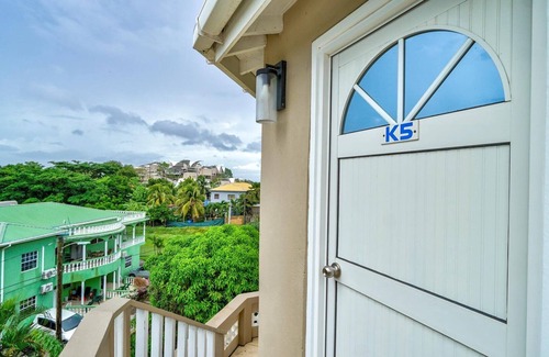 Calliste Apartment | Quaint one bedroom unit steps away from beach access
