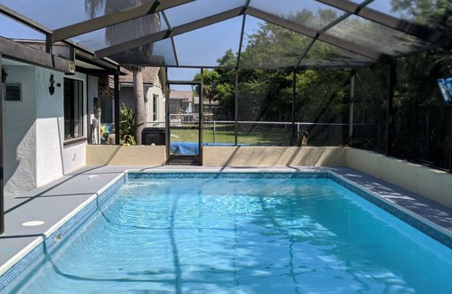 Hudson House | Quiet Gulf Canal Neighborhood with Enclosed Lanai & Heated Pool EV friendly