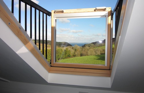 Helford Passage Cottage | Quirky luxury chalet-style cottage, beautiful sea views across a wooded valley