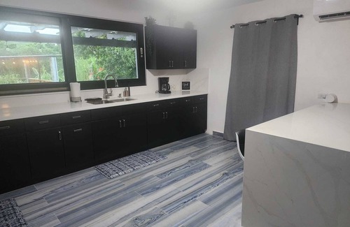 Mameyes II House | Rainforest Serenity Home- Charming 3-bedroom home in Río Grande, WiFi, AC & Pool
