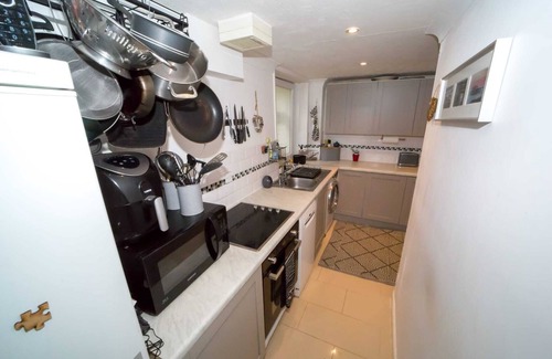 Meads Apartment | Rare basement flat in best location,free parking on site, private sunny patio