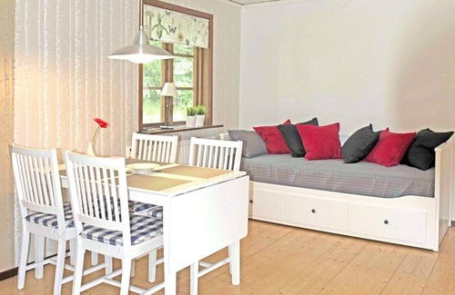 Holsbybrunn House | Red and white holiday home beautifully situated by the river Emån