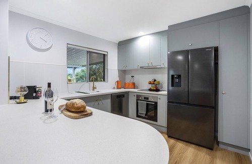 Mooroobool House | Refreshed Family Home with Large Deck and Tropical Mountain View