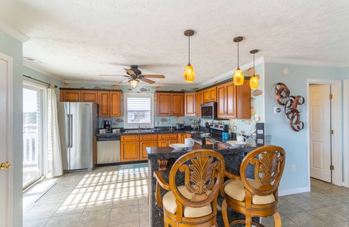 Corolla House | Relax among the dunes and see wild horses from the porch at Shifting Sands!