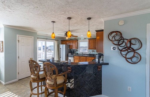 Corolla House | Relax among the dunes and see wild horses from the porch at Shifting Sands!
