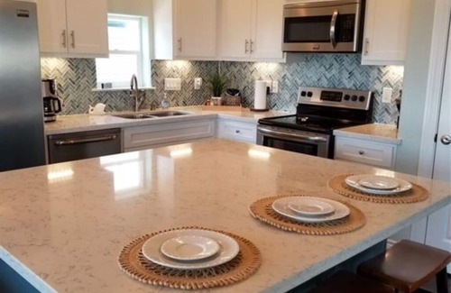 San Luis House | Relax and enjoy water views of the Gulf and beautiful home so near the beach!