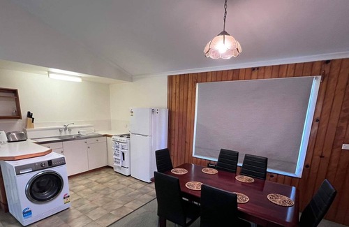 Burnt Pine Cottage | Relax in a 2 bedroom cottage a short walk from cafes, restaurants and shops