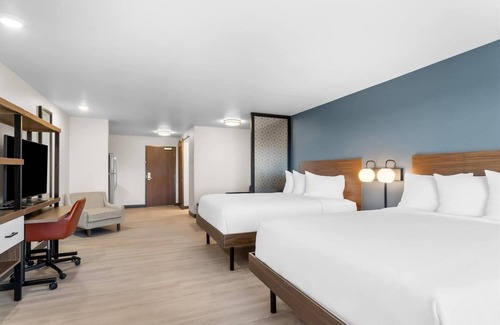 Cheyenne Hotel | Relax in a Comfortable Suite w/Fully Equipped Kitchen & Dedicated Workspace
