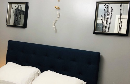 Saint Thomas House | Relax in our cozy room with a private bath, designed for comfort and privacy.