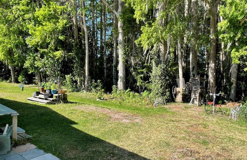 Wildwood House | Relax in style—lanai, golf cart & tranquil wooded views included!
