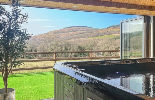Neath Cottage | Relax in the shared indoor heated swimming pool, hot tub or sauna.