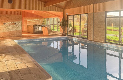 Neath Cottage | Relax in the shared indoor heated swimming pool, hot tub or sauna.
