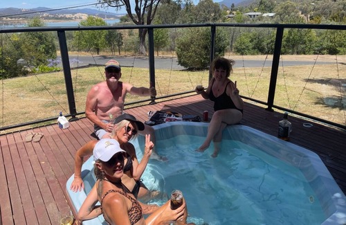 Goughs Bay House | Relax in the spa with views opposite Lake Eildon