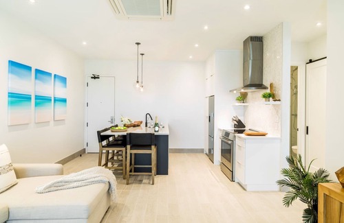 Long Bay Hills Resort | Relax on a Juliette balcony with an ocean & pool view!