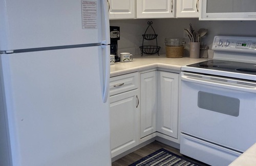 Camdenton Condo | Relax on your screened in balcony overlooking the Lake. Two Golf Courses nearby.