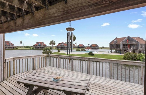 Matagorda Condo | Relax poolside with the whole family or hunt shells on the beach.